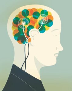 Illustration of a human head with a colorful brain representing neurofeedback, with electrodes attached to the scalp.