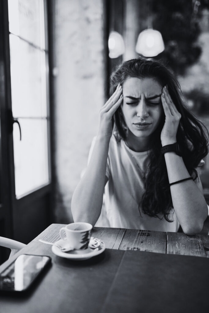 young woman suffering with migraine